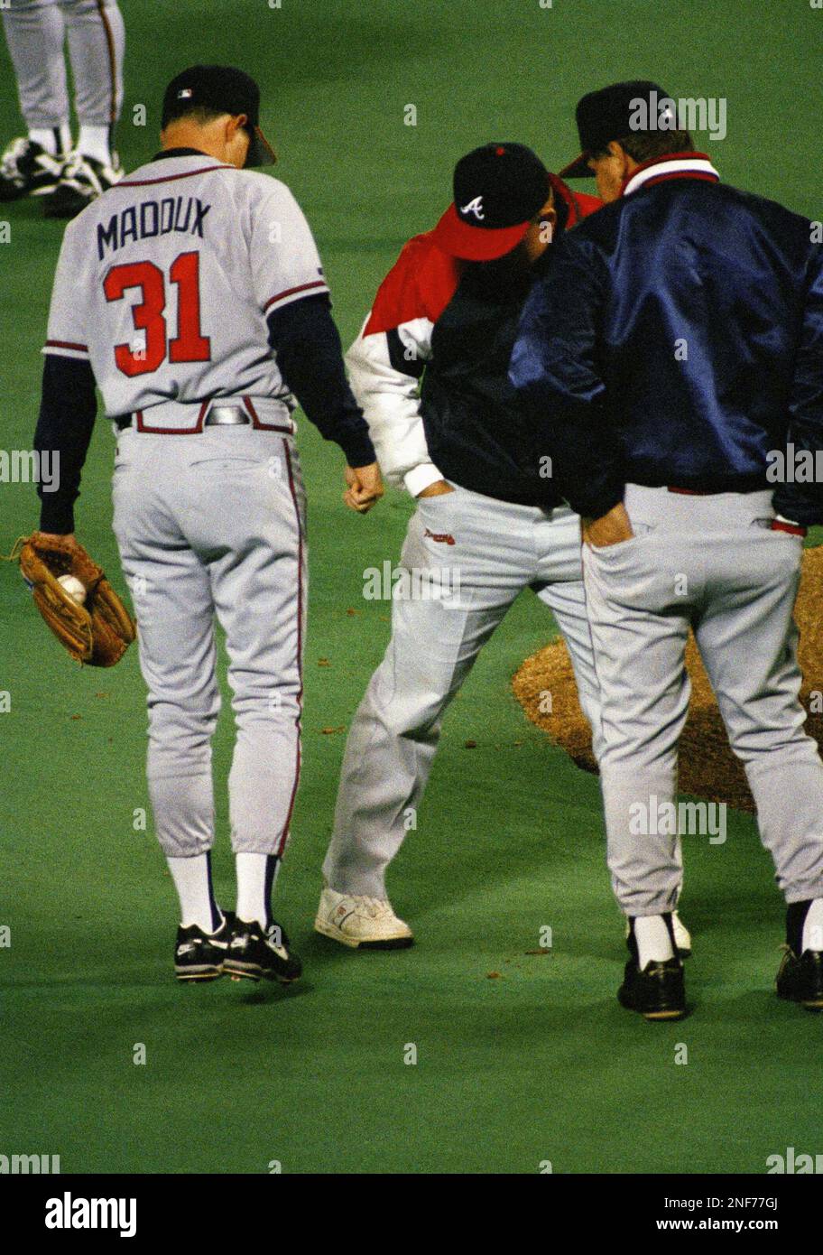 Hall of Famer and former Atlanta Braves pitcher Greg Maddux throws out the  ceremonial first pitch before Game 5 of the World Series between the  Atlanta Braves and the Houston Astros on