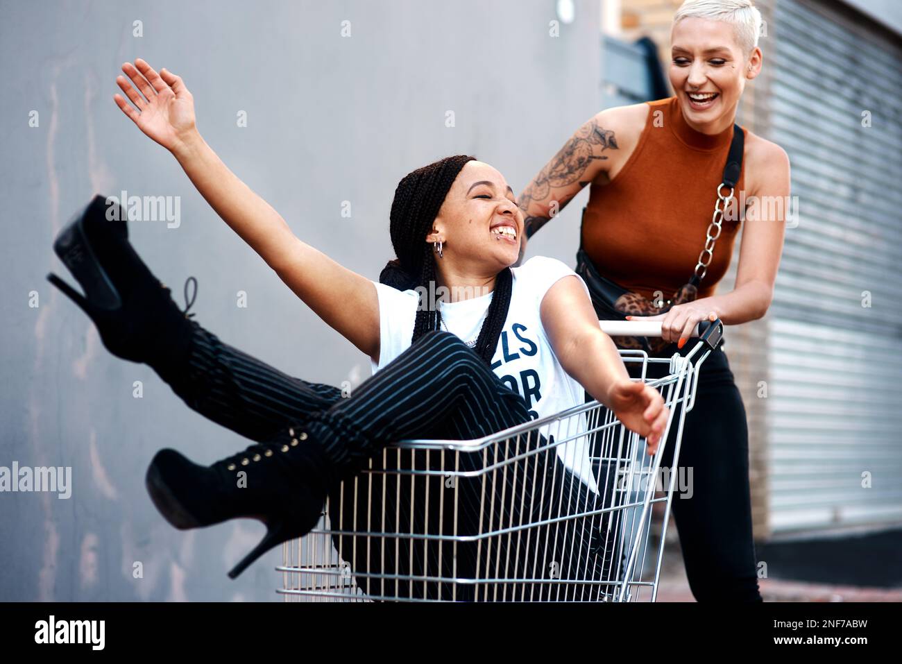 Push Friend Happiness is just a trolleys push away. an energetic young woman ...