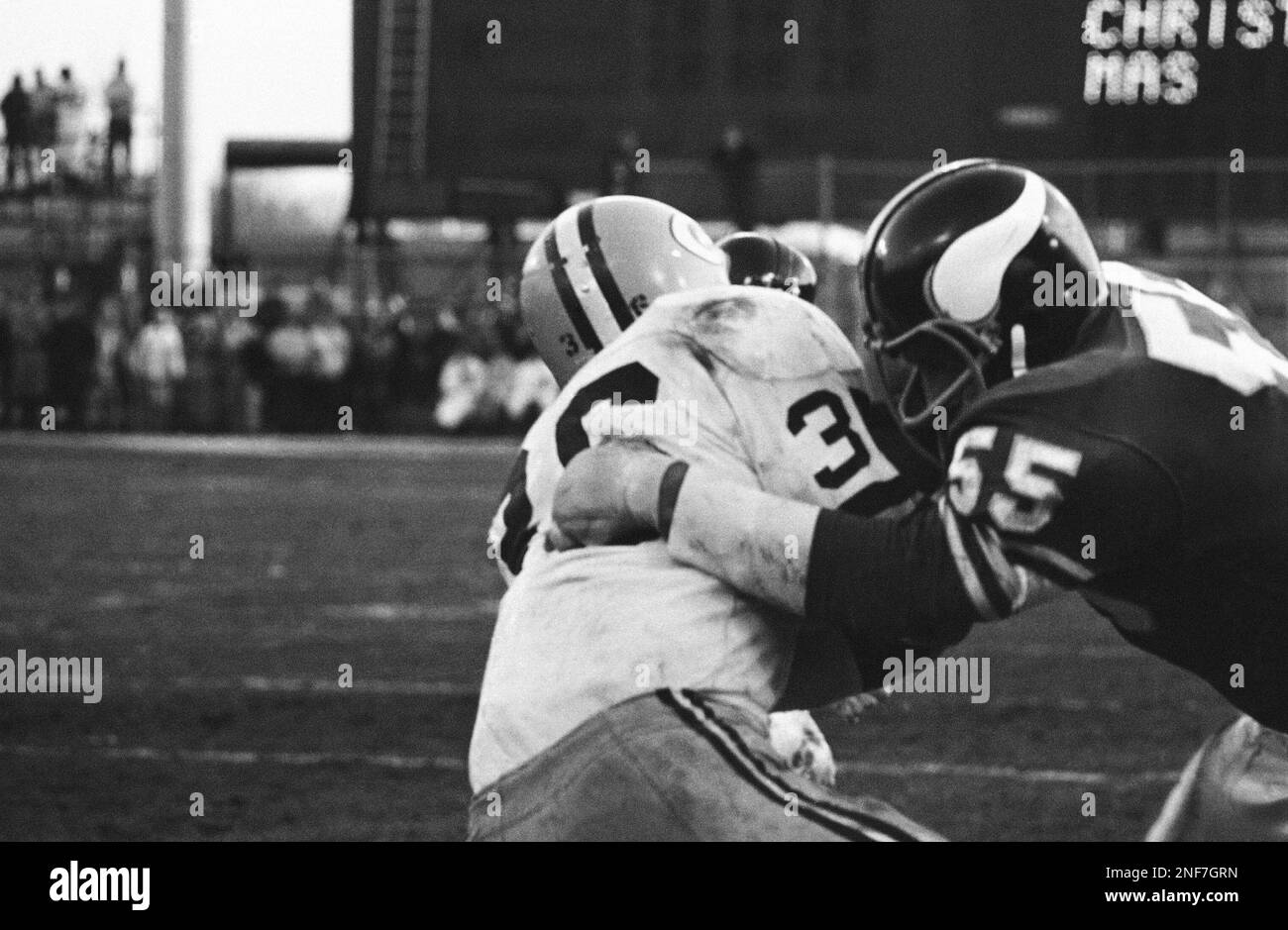 Green Bay Packer's Ben Wilson (36) plunges over goal line in front of  Minnesota Viking's Lonnie Warwick (59) for third period touchdown during  National Football League game in Twin Cities on Sunday,