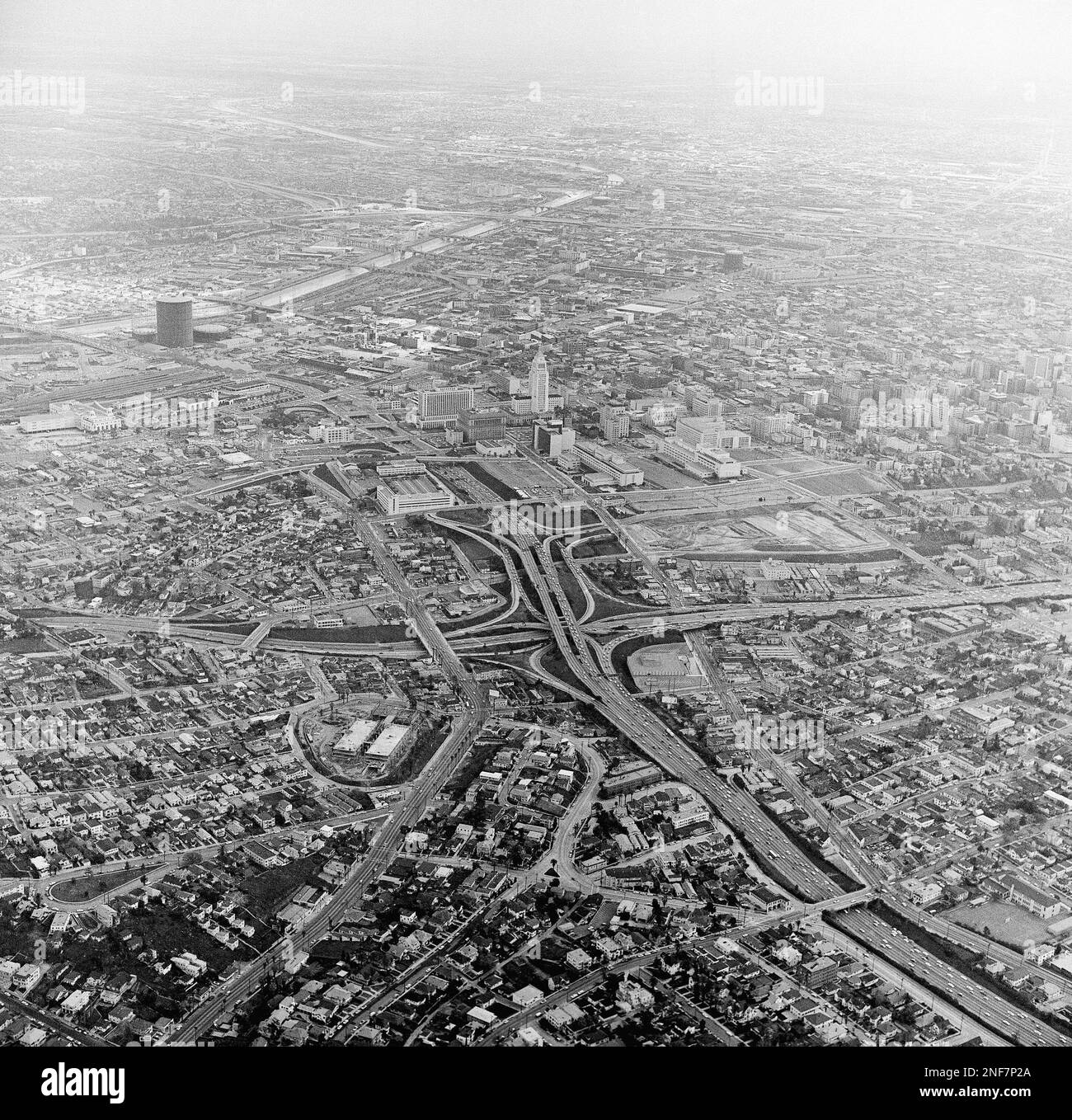 A four-level freeway interchange, which speeds traffic in all directions, near downtown is shown 