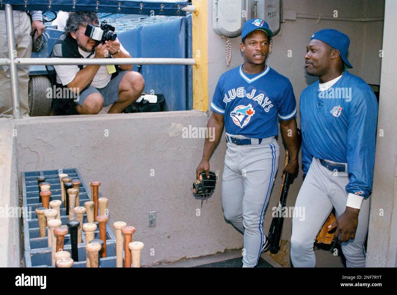 Toronto Blue Jays Rickey Henderson hit a home run off Oakland Athletics  pitcher Ron Darling as A's catcher Scott Hemond watches the play in the  fifth inning at Oakland, Aug. 30, 1993.