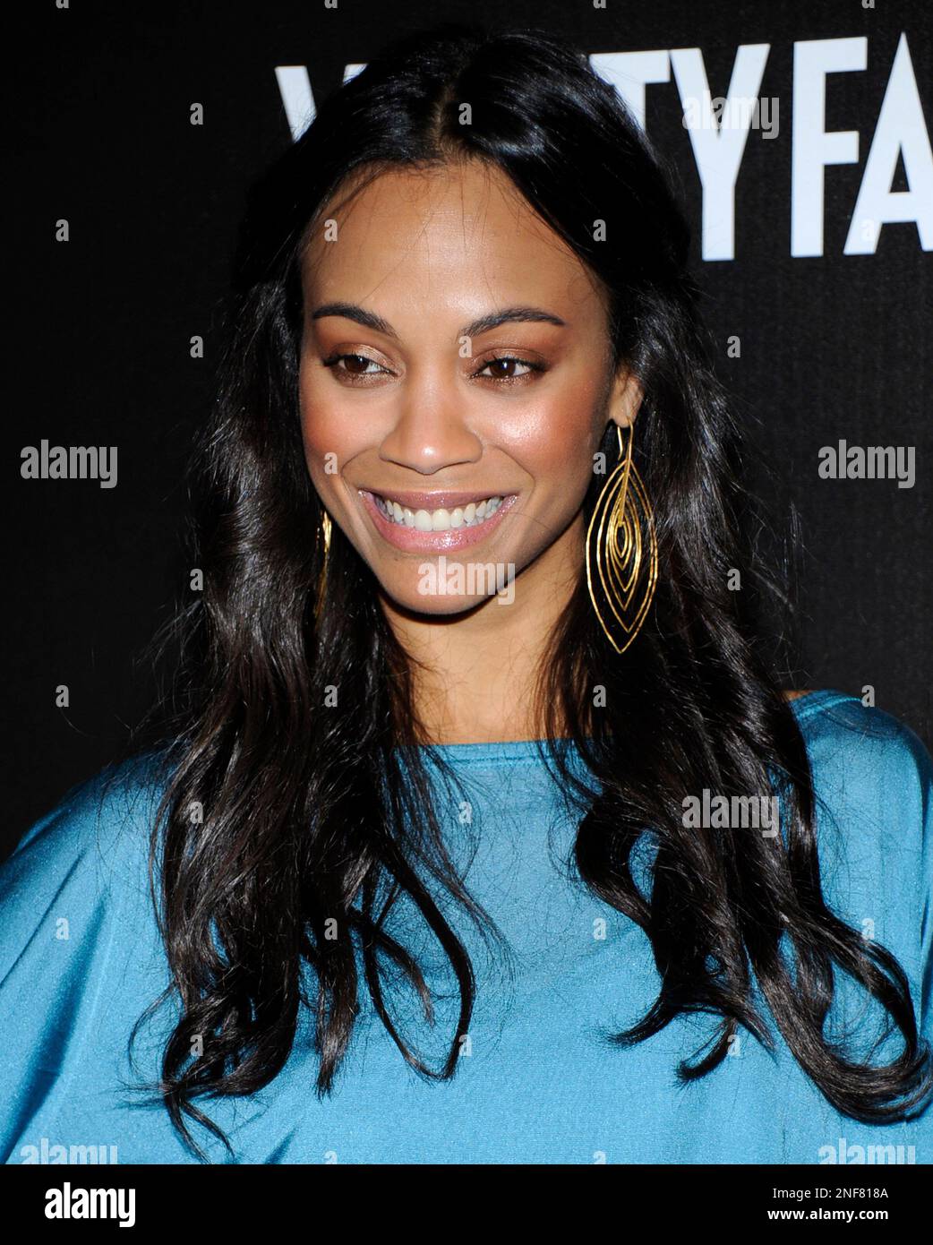 Actress Zoe Saldana poses on the press line at the Vanity Fair/Bally