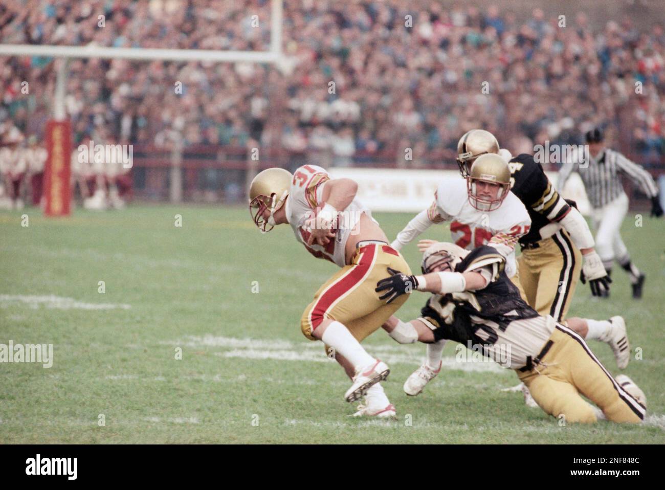 Boston College’s Duke St. Pierre slips through the Army defense line