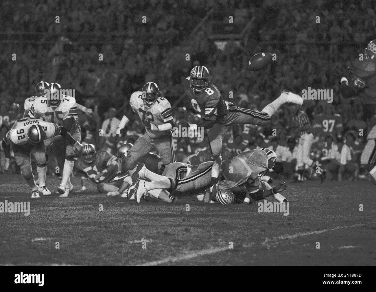 Ohio State quarterback Rod Gerald (8) throws a pass as he is hit during