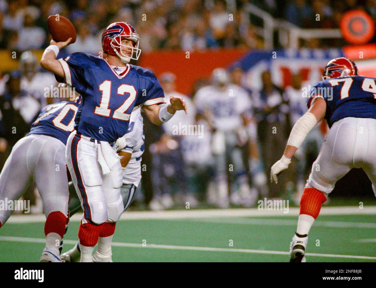 Buffalo Bills quarterback Jim Kelly (12) looks for an open receiver first  quarter action against the Dallas Cowboys at Super Bowl XXVIII in the  Georgia Dome, Sunday, Jan. 30, 1994. The Cowboys