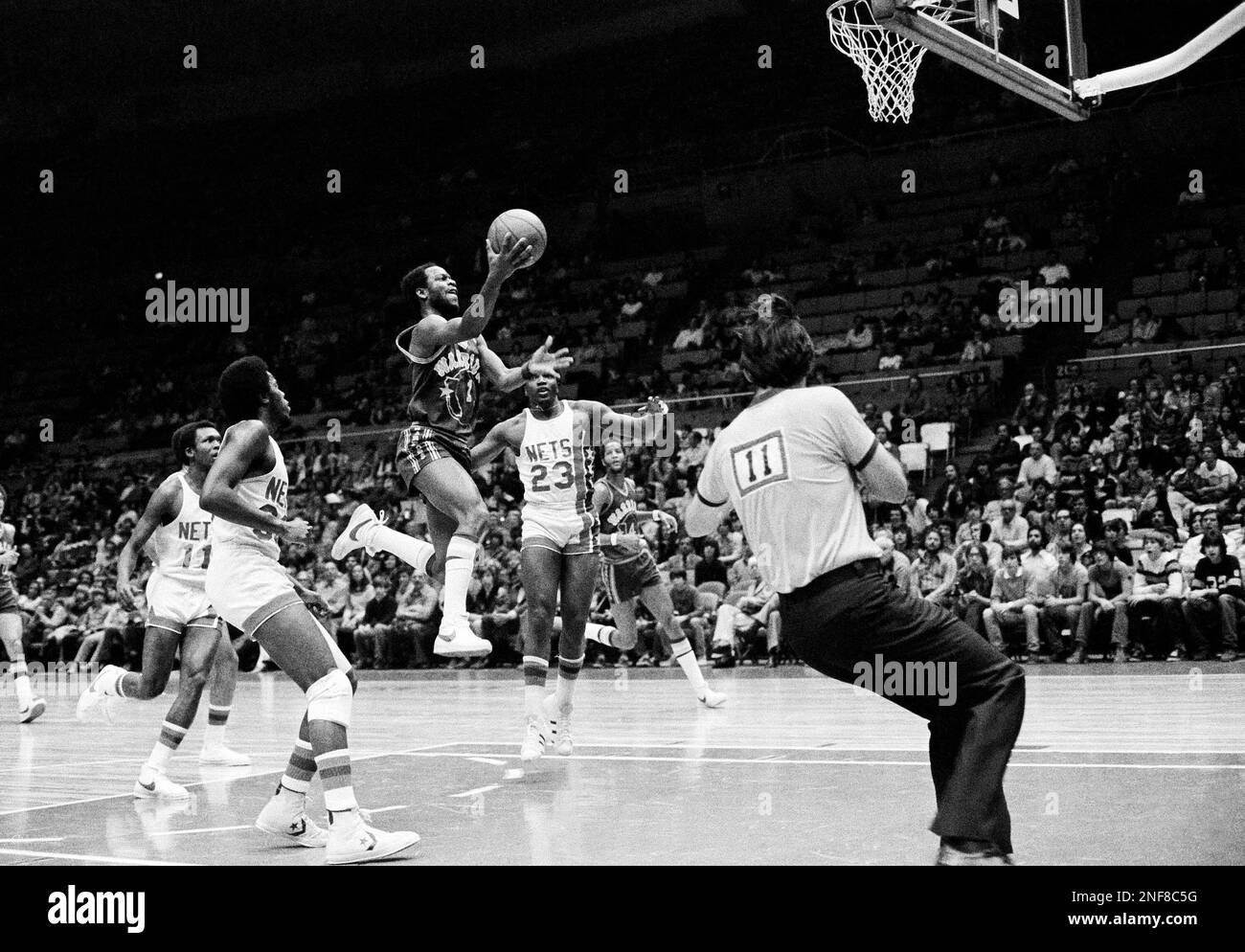 New York Nets Jan van Breda Kolff leans on Buffalo Braves John