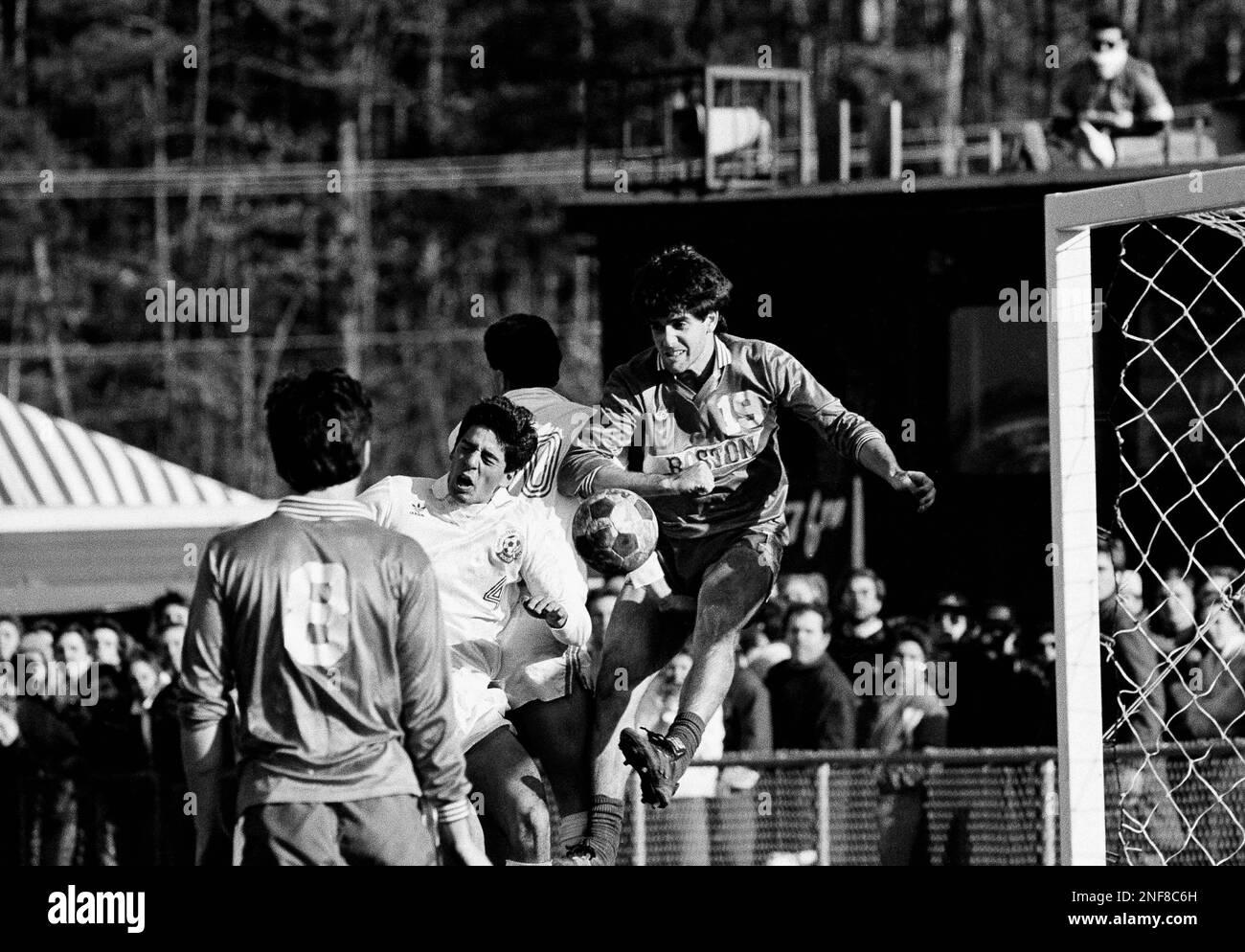 Ricardo Penfold of Boston University (19) clears out the ball from near ...