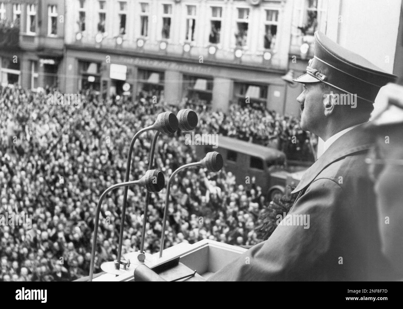 Adolf Hitler speaks to supporters on the balcony during his visit to the third zone of the occupied German territories where he was jubilantly cheered, Oct. 3, 1938, Eger, Hungary. (AP Photo) Stock Photo