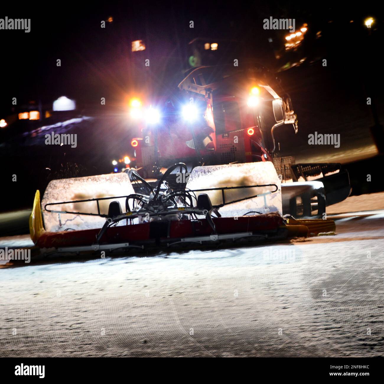 Oberwiesenthal, Germany. 15th Feb, 2023. A snow blower drives on the