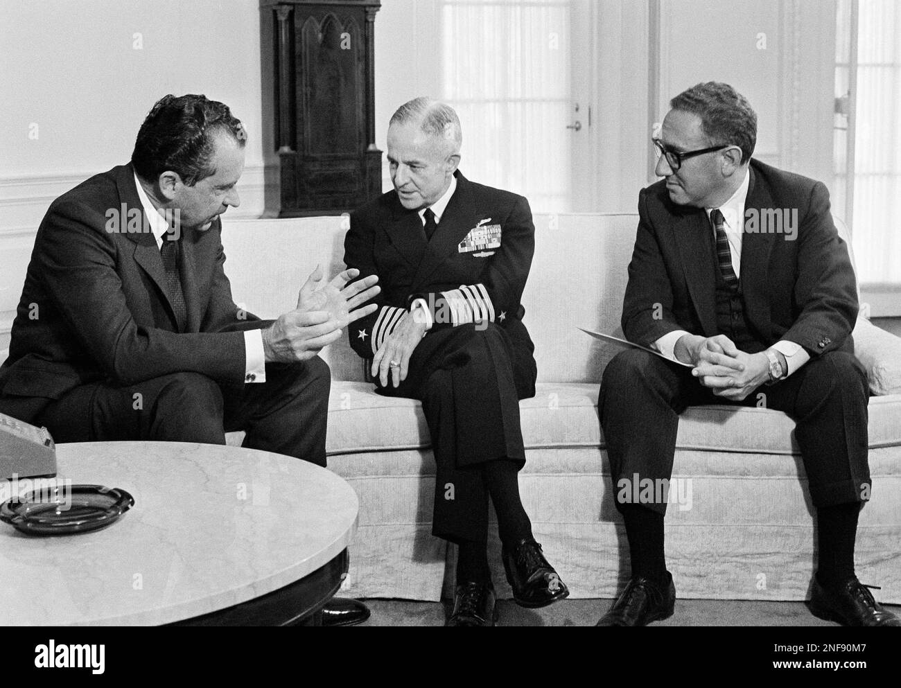 U.S. President Richard Nixon conferred at the White House with Adm John McCain, commander in chief of the United States Pacific Forces, Feb. 11, 1969 in Washington. Admiral McCain has been a patient at Bethesda Naval Hospital after suffering a mild stroke last month. At right is Henry Kissinger. (AP Photo) Stock Photo