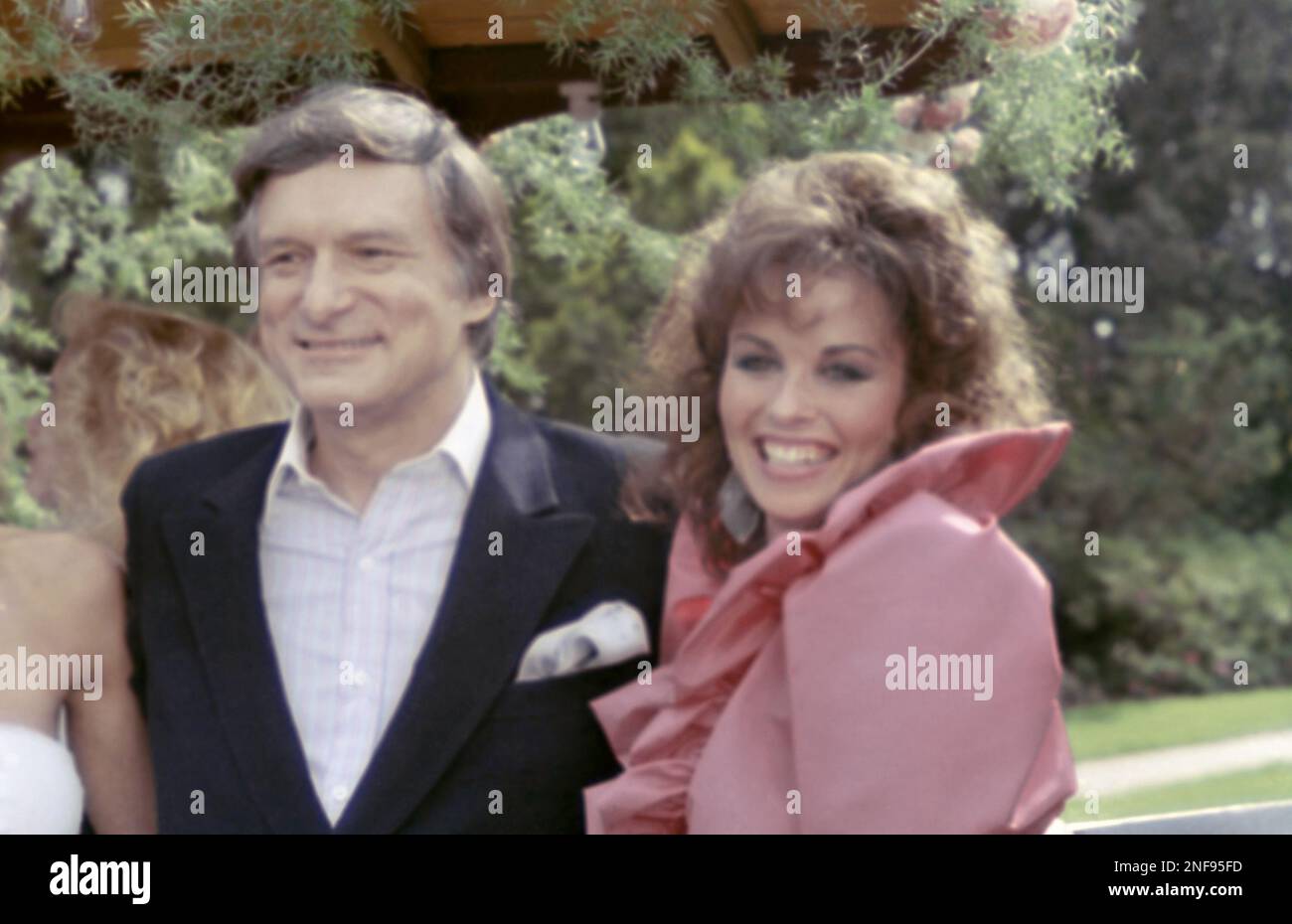 Playboy publisher Hugh Hefner, left, poses with 23 year old September 1983 Playmate Barbara