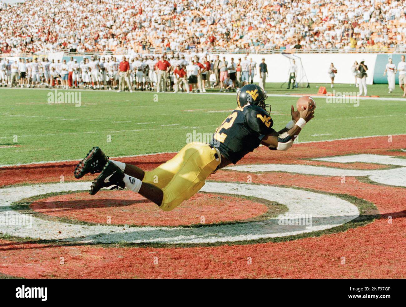 West Virginia tight end Lovett Purnell (82) dives for a touchdown pass, Jan. 2, 1995 in second