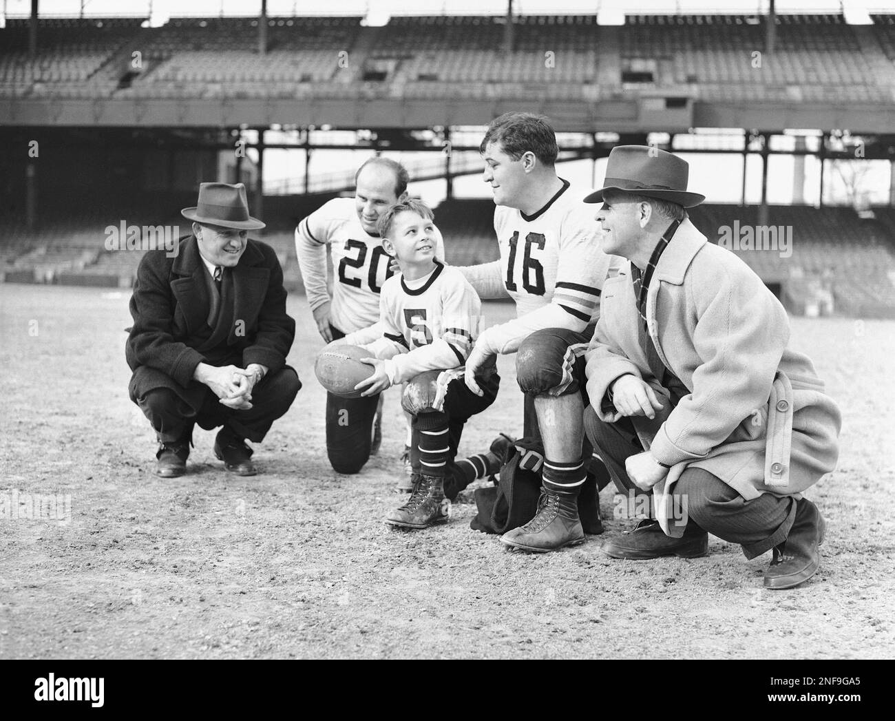 Heartley Anderson, Jr., 10, mascot of the Chicago Bears, looks all ready  for the Bear's championship professional football game with the Washington  Redskins at Washington, Dec. 8, 1940. The youngster is the