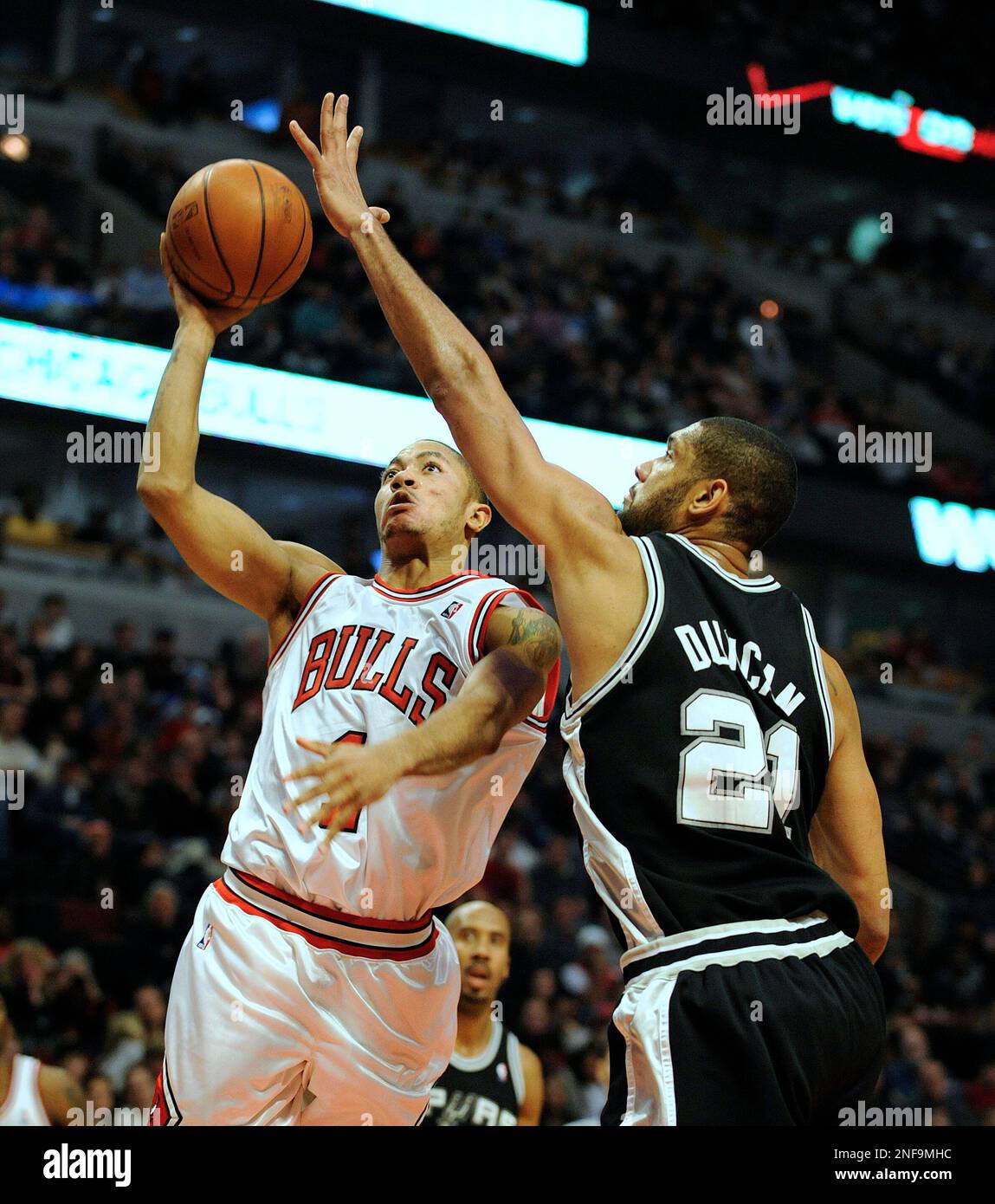 The Chicago Bulls Derrick Rose scores over the San Antonio Spurs Tim Duncan during the second half of an NBA basketball game Saturday Jan. 17 2009 in Chicago. AP Photo Jim Prisching Stock