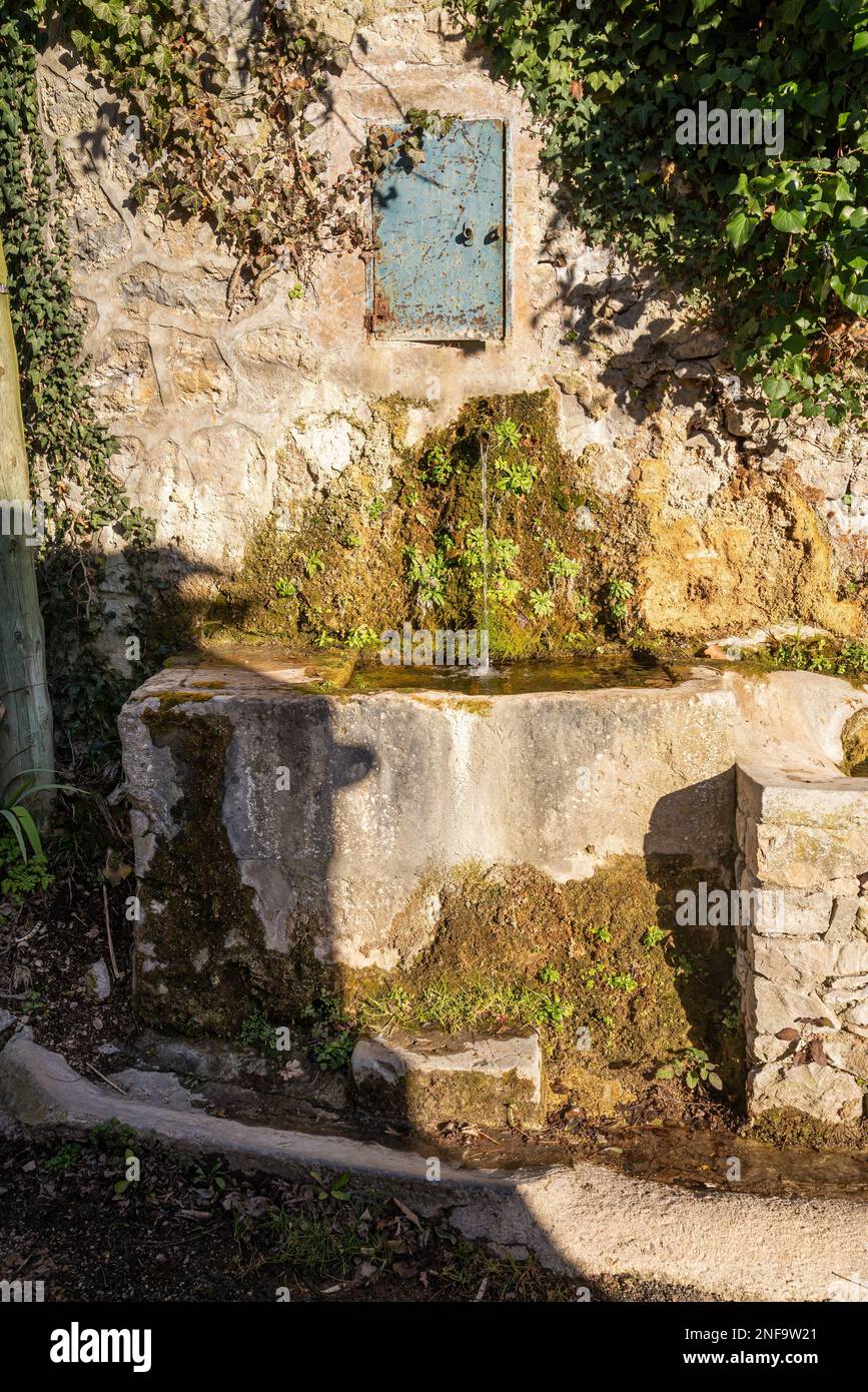 A fountain in the small town of Mazaugues in the Var department, located at the eastern end of the Sainte-Baume massif, in the Provence region of Fran Stock Photo