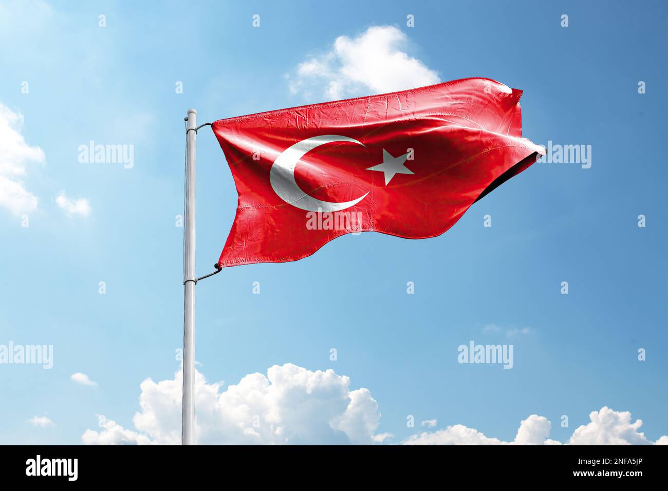 3d Illustration of Flag of Turkey waving in the wind against a blue sky with clouds and clipping path. Stock Photo