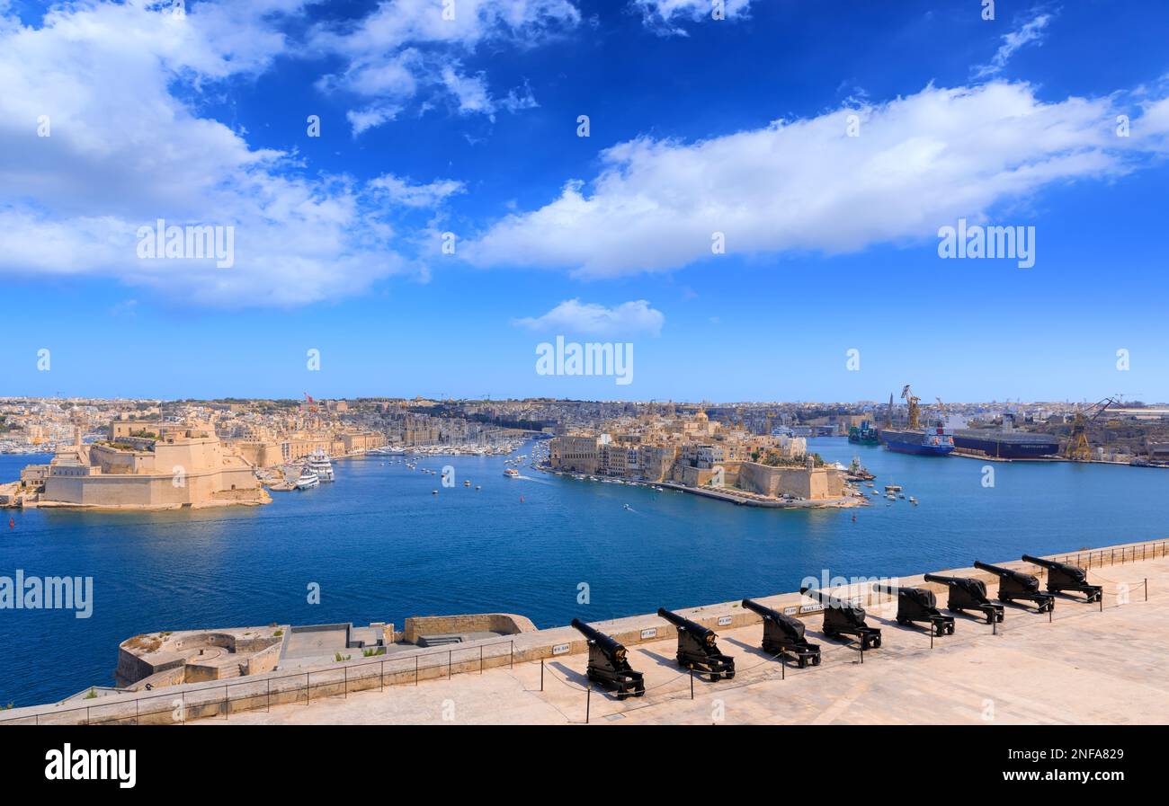 The Grand Harbour  and Saluting Battery in Valletta, capital of Malta: view from Upper Barrakka Gardens of The Three Cities. Stock Photo