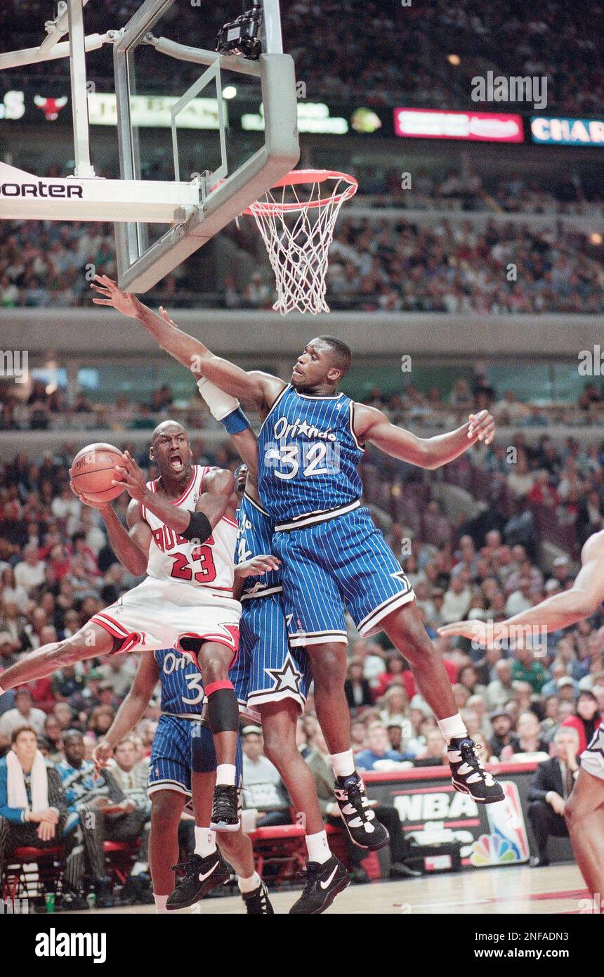 Chicago Bulls' Michael Jordan goes up to the basket under Orlando Magic's  Shaquille O'Neal (32) during the fourth quarter of a second-round playoff  game in Chicago, May 14, 1995. Chicago Bulls kept