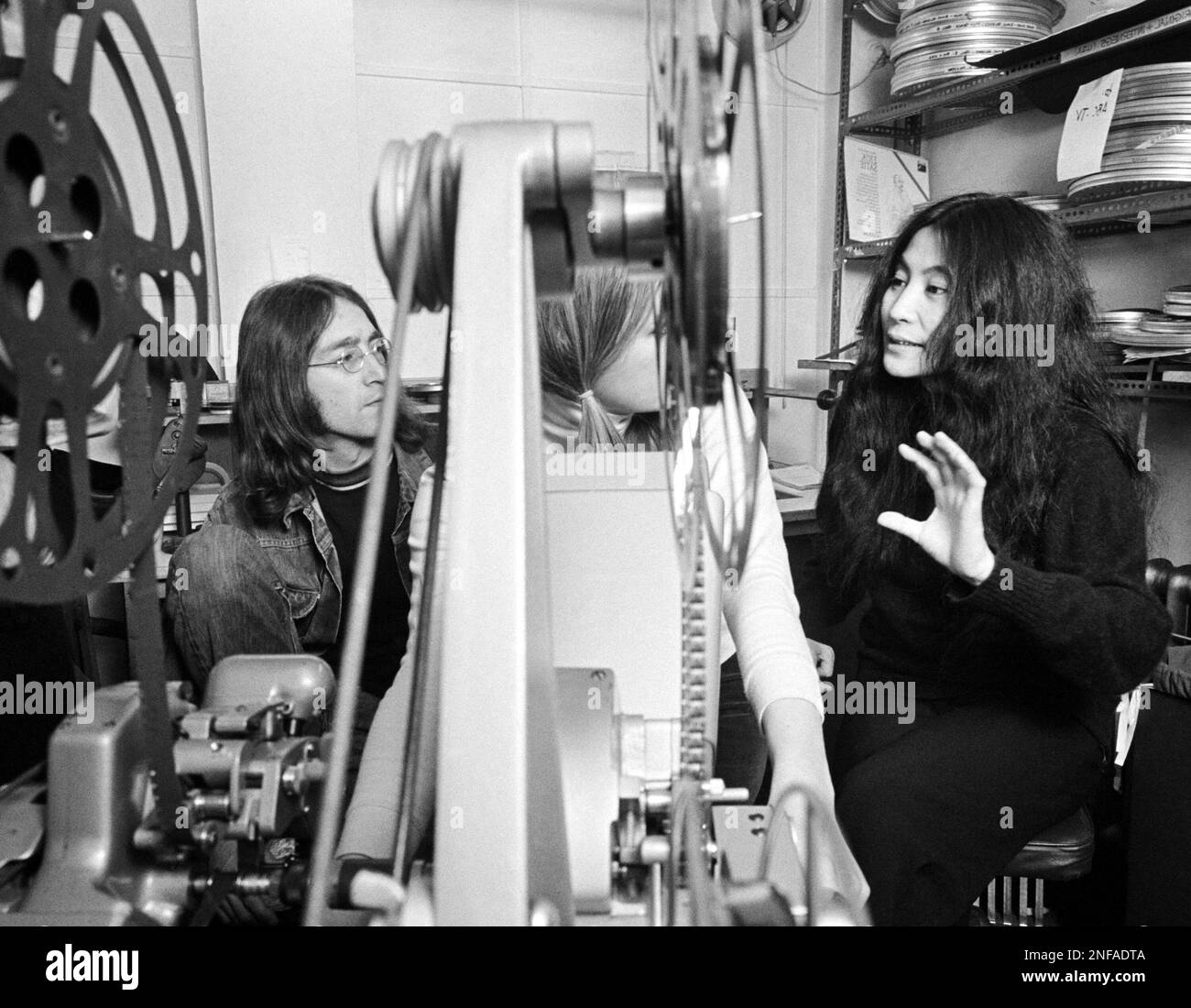 Beatle John Lennon, left, and his friend Japanese actress Yoko Ono go  through the editing of the film 