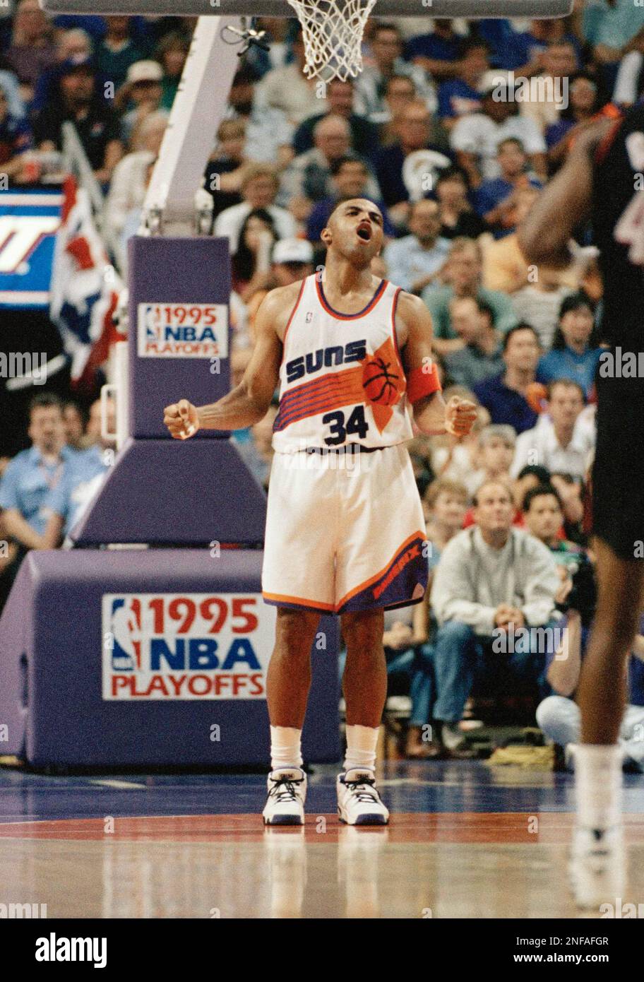 Phoenix Suns forward Charles Barkley lets out a yell as the Suns defeat the Portland Trail Blazers 103-94 at Phoenix, April 30, 1995. The Suns lead the best-of-five series 2-0. (AP Photo/Eric Drotter) Stock Photo