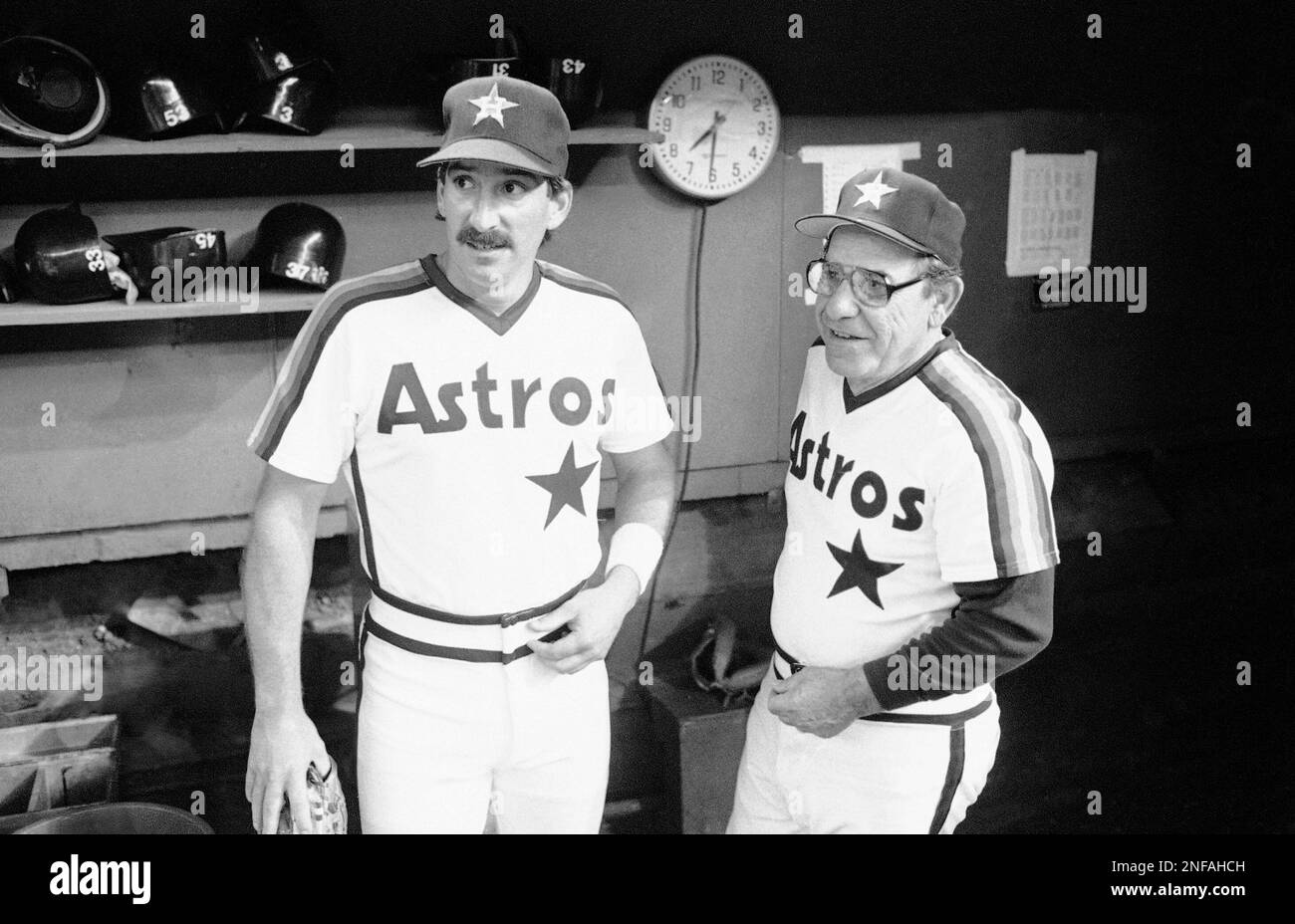 Houston Astros coach Yogi Berra looks over the field with son and