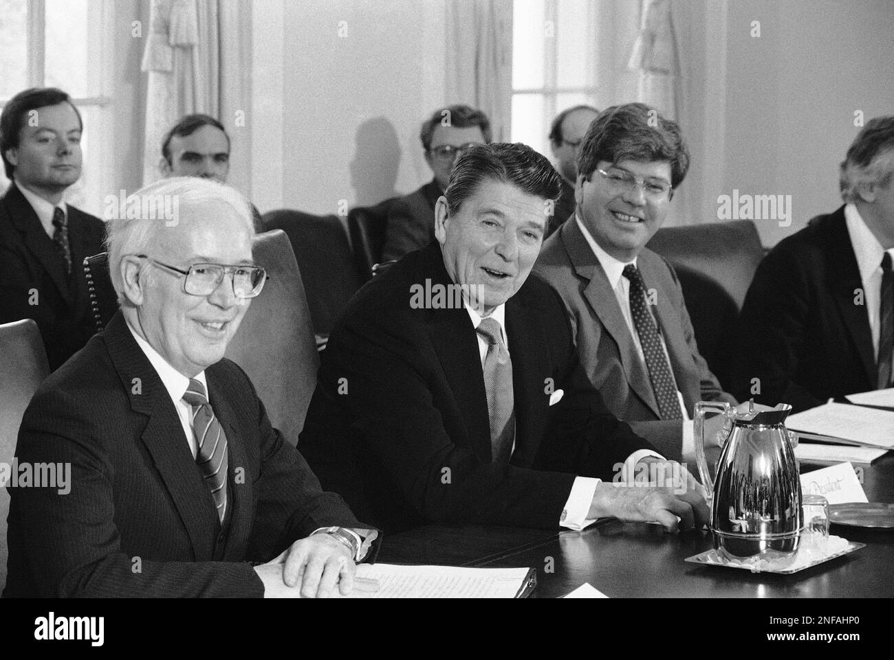 President Ronald Reagan is flanked by Education Secretary Terrel Bell ...