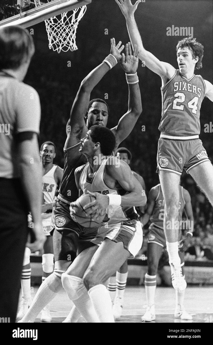 Milwaukee s Marques Johnson 8 waits to move for the basket as