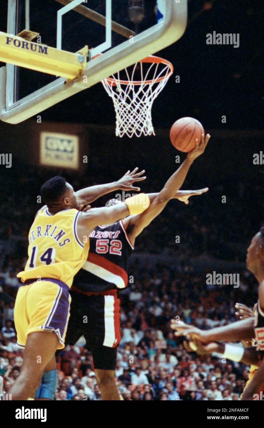 Buck Williams, 52, of the Portland Trail Blazers crashes