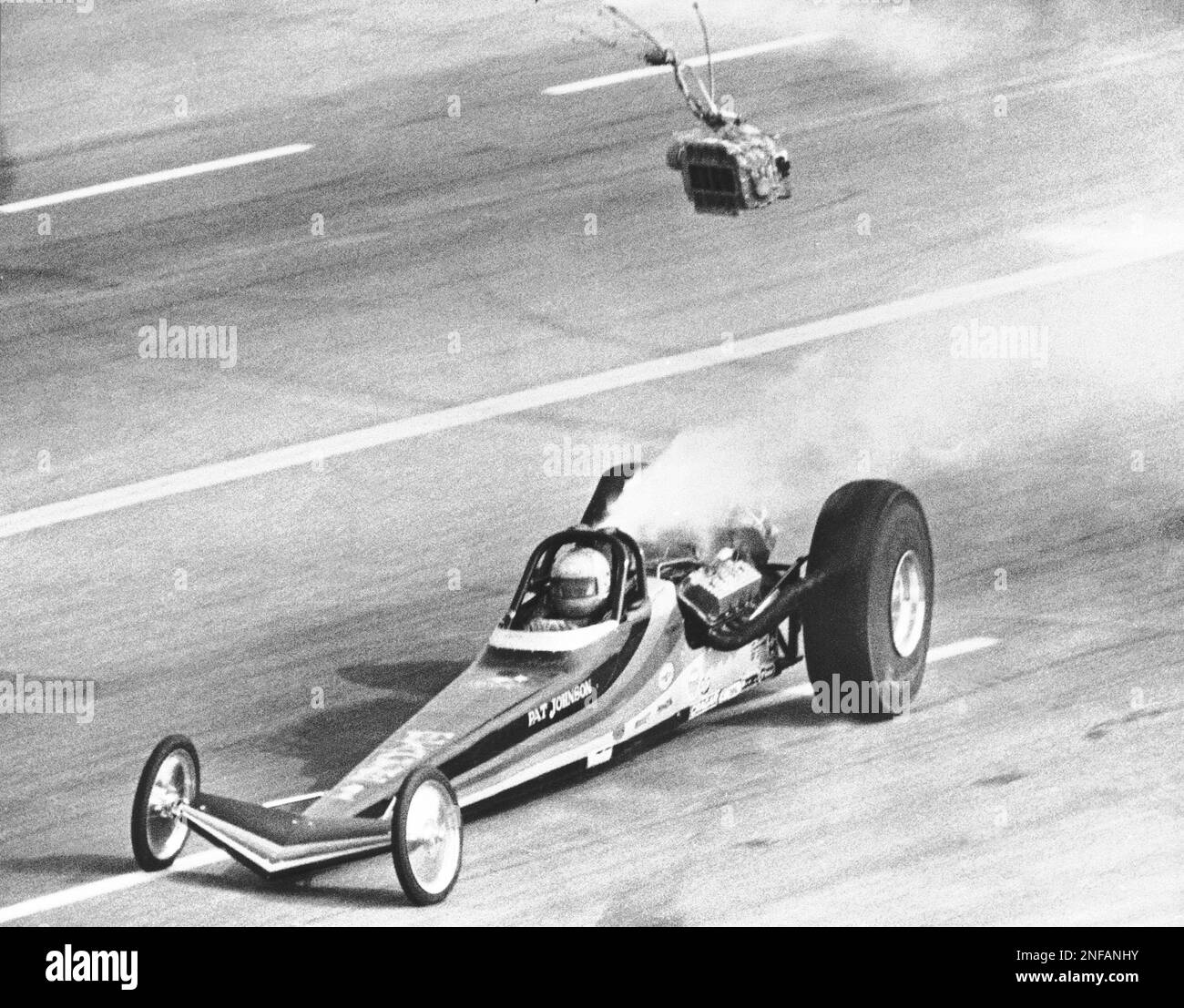 A dragster supercharger hits cameraman Joe Rooks of Bowling Green, Ohio