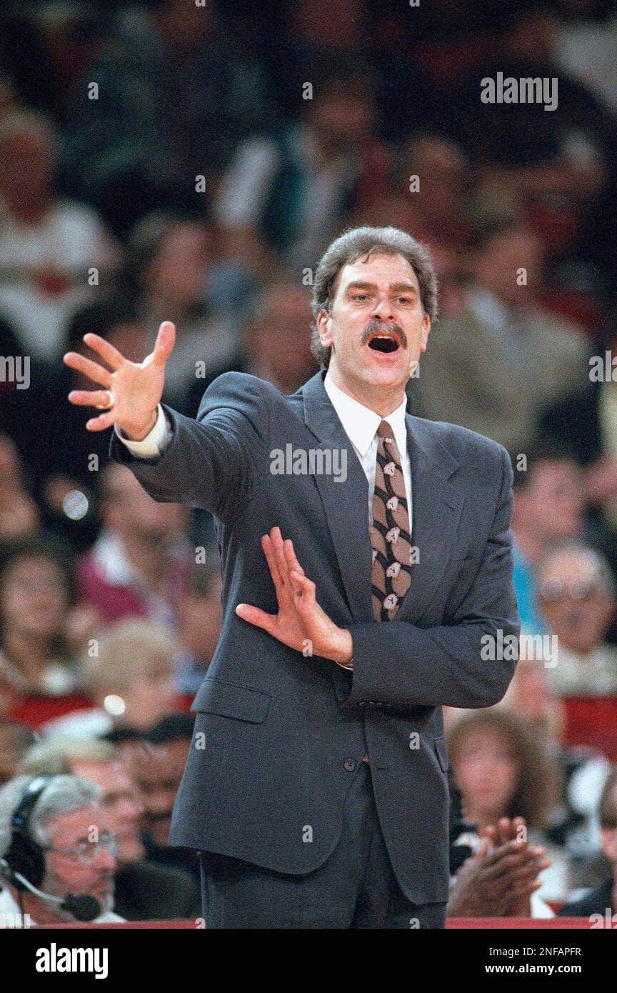 Chicago Bulls coach Phil Jackson hoists the NBA championship