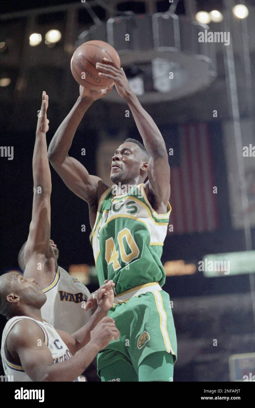 Seattle SuperSonics Shawn Kemp, right, shoots over Golden State