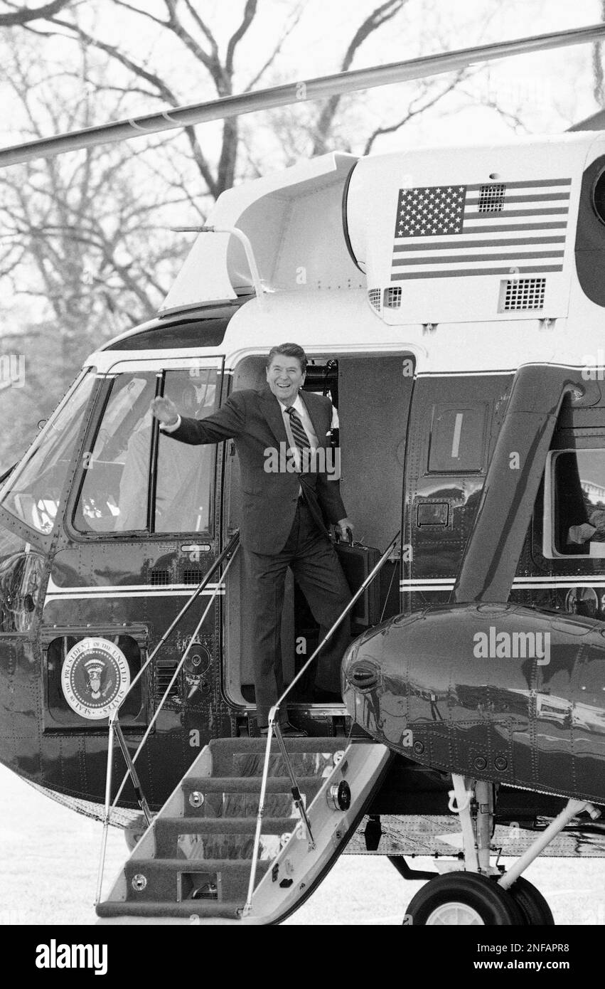 President Ronald Reagan waves from the steps of Marine One shortly