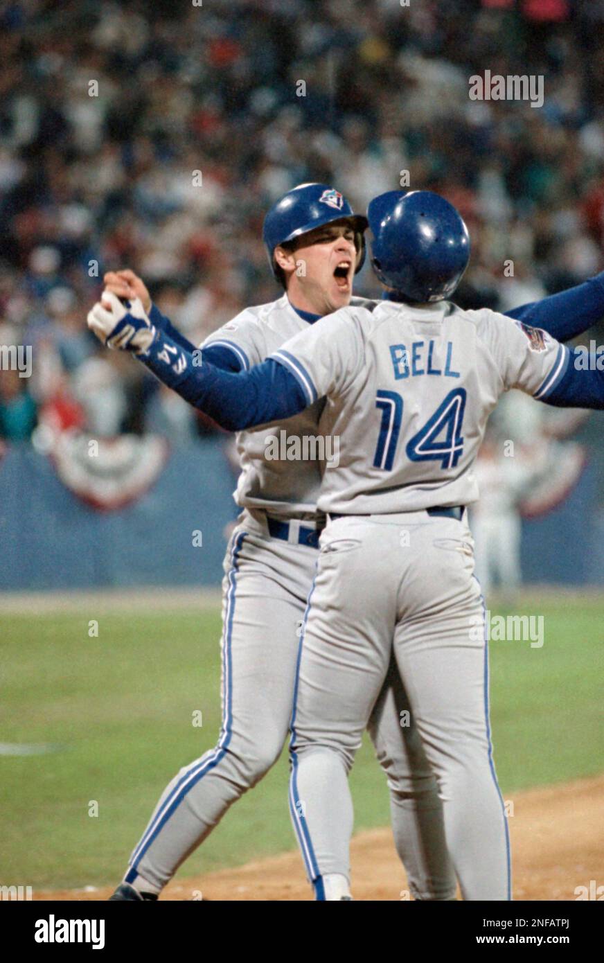 Toronto Blue Jays Ed Sprague, left, celebrates with Derek Bell (14) after  Sprague's game-winning two-run homerun in the 9th inning that downed the  Atlanta Braves 5-4 in Game 2 of the World