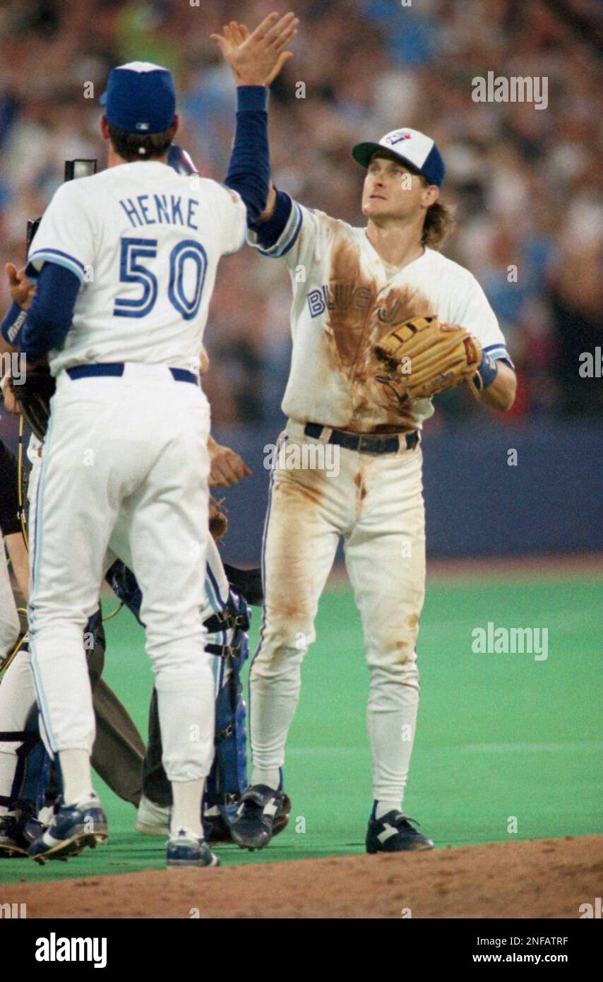 Toronto Blue Jays third baseman Kelly Gruber, right, congratulates relief  pitcher Tom Henke after Henke saved Game 4 of the World Series against the  Atlanta Braves at SkyDome in Toronto, Oct. 22