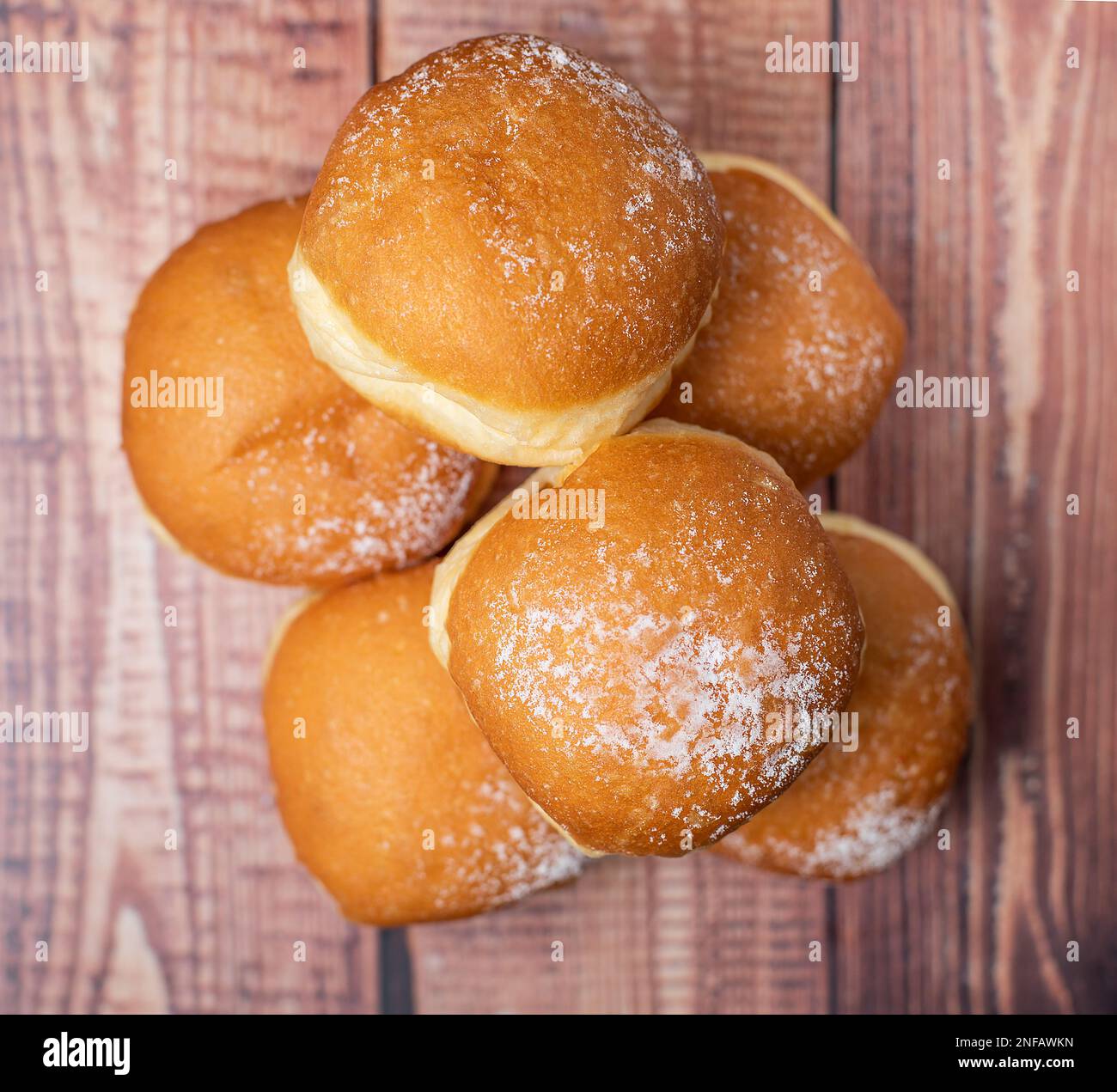 Austrian and german donuts or krapfen. Berliner with cream. On wooden background. Selective focus. Stock Photo