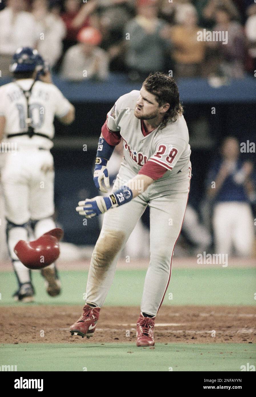 Philadelphia Phillies batter John Kruk throws his batting helmet after  striking out with the bases loaded in the sixth inning during Game 1 of the  World Series with the Toronto Blue Jays