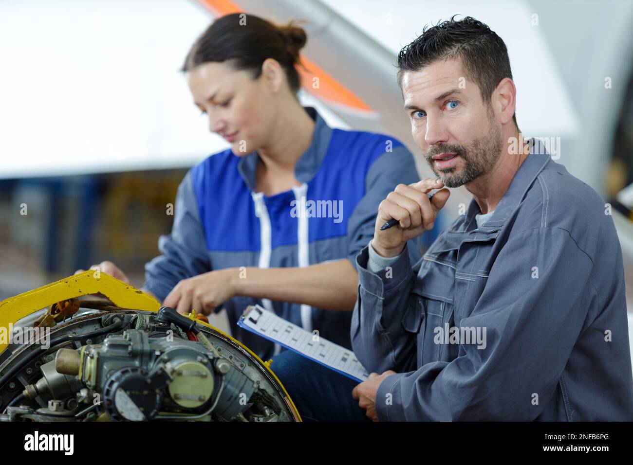 an apprentice is studying engines Stock Photo