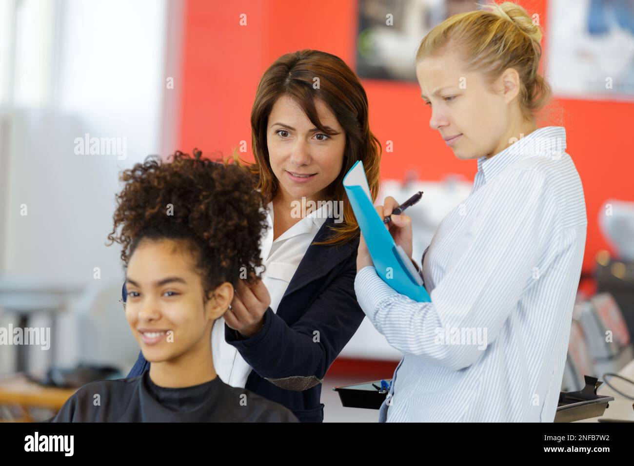 Hairdresser apprentice hi-res stock photography and images - Alamy