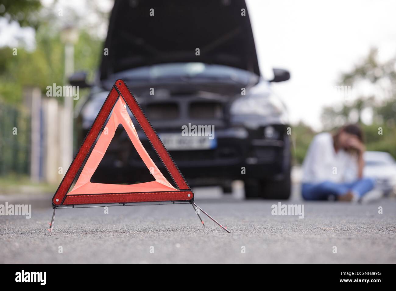 a triangle and broken car concept Stock Photo - Alamy