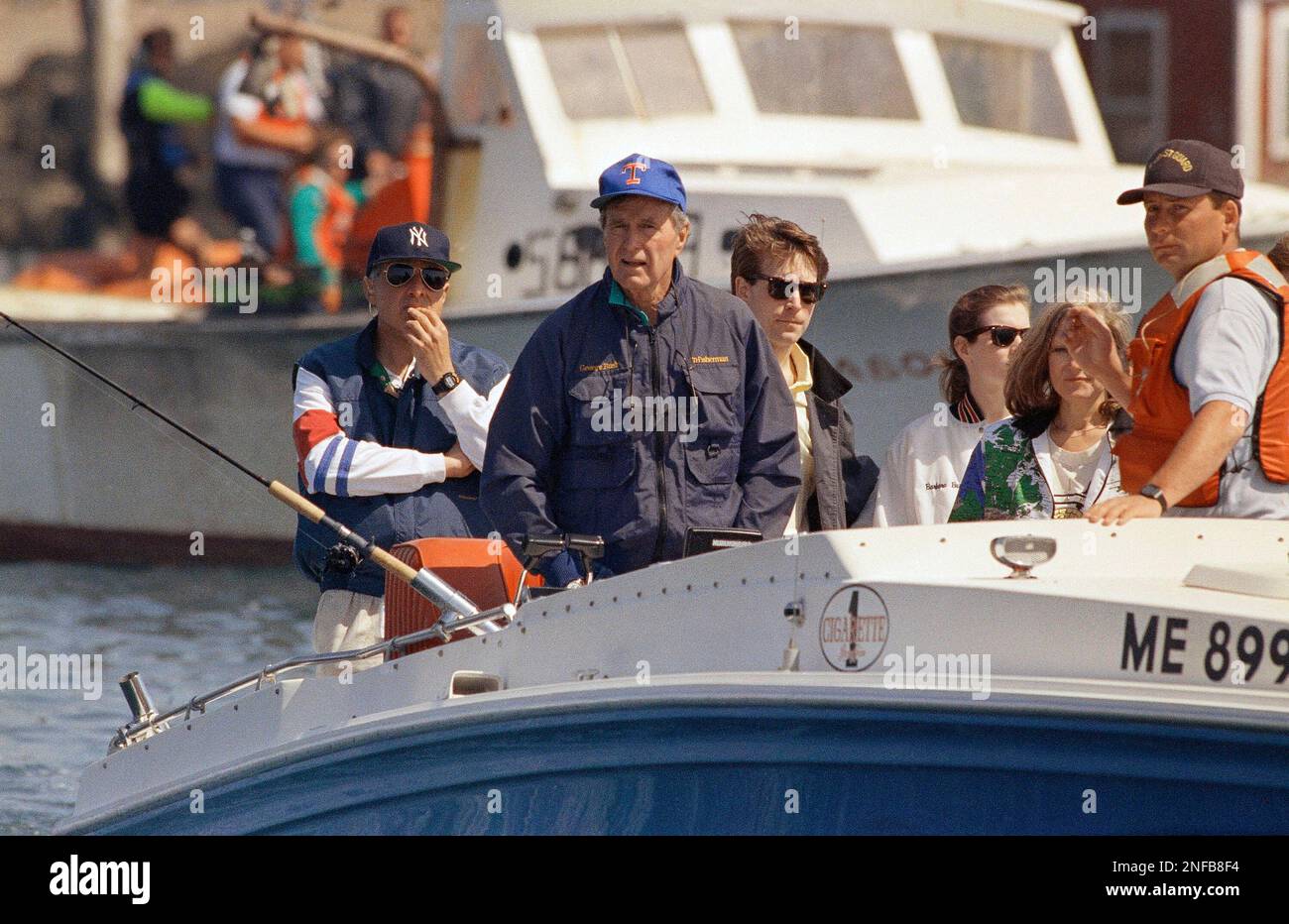 george bush cigarette boat President George Bush pilots his boat Fidelity at Cape Porpoise, Me., near  his vacation home, May 23, 1992. At far right is Dave Worthley of the Coast  Guard. At left is an