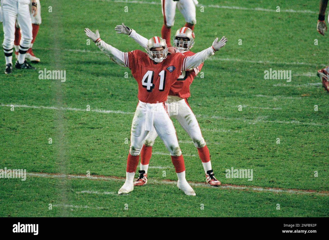 San Francisco 49ers Toi Cook (41) and Merton Hanks dance as they celebrate in the fourth quarter of Super Bowl XXIX as the 49ers headed to a 49-26 victory over the San Diego Chargers at Joe Robbie Stadium in Miami, Jan. 29, 1995. (AP Photo/Marta Lavandier) Stock Photo