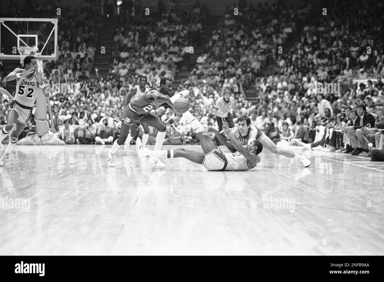Philadelphia 76ers Andrew Toney (22) drives against Los Angeles Lakers Mike  Cooper, left, during second half action in the NBA Championship game at  Philadelphia June 7, 1982. The 76ers won, 135-102, and