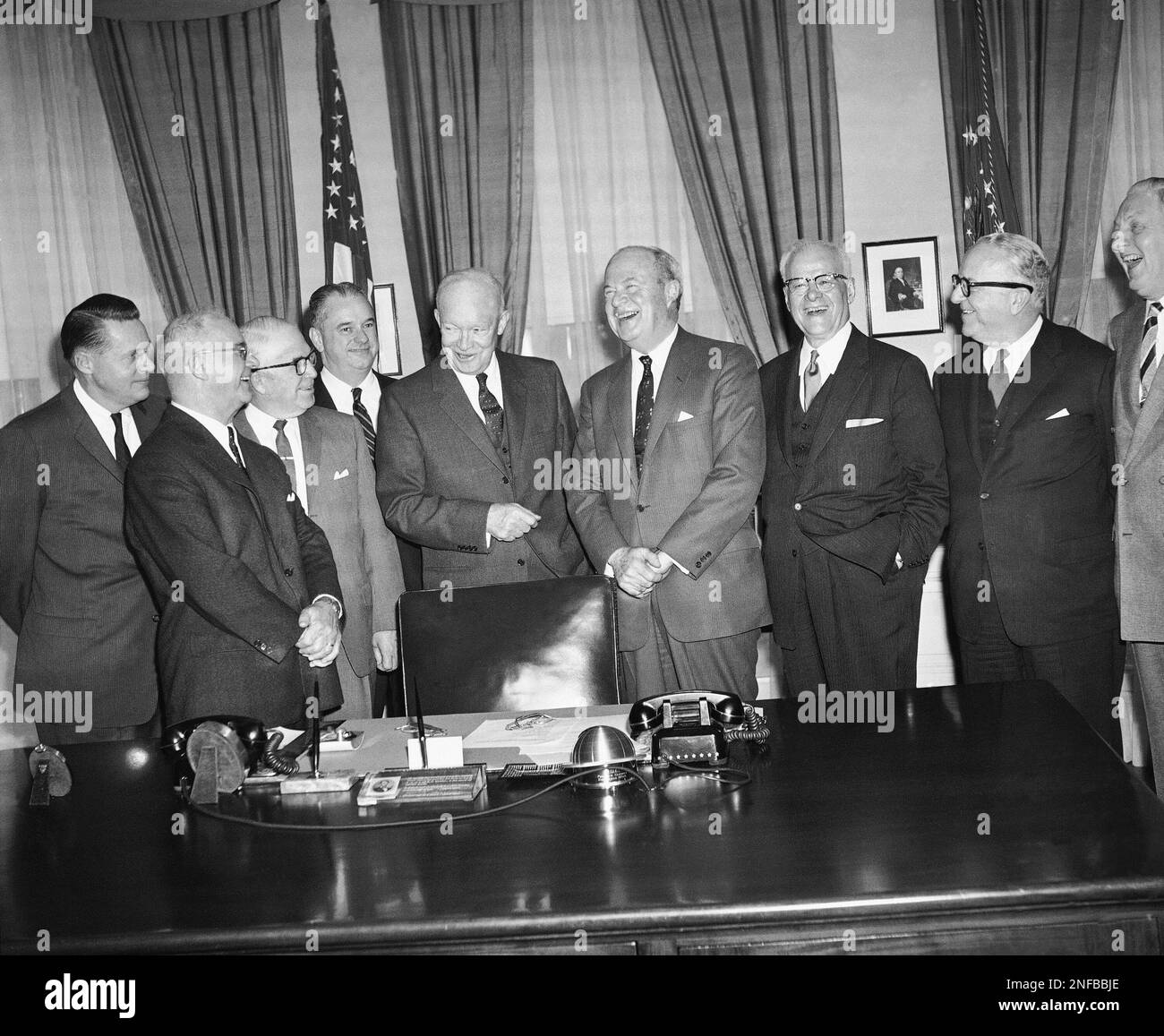 President Dwight Eisenhower poses at the White House in Washington with
