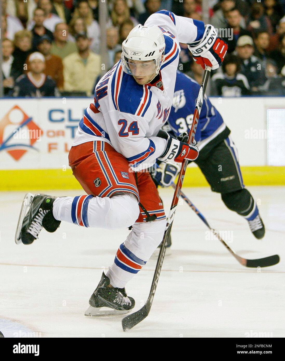 New York Rangers' Ryan Callahan tries to deflect a puck during an NHL ...