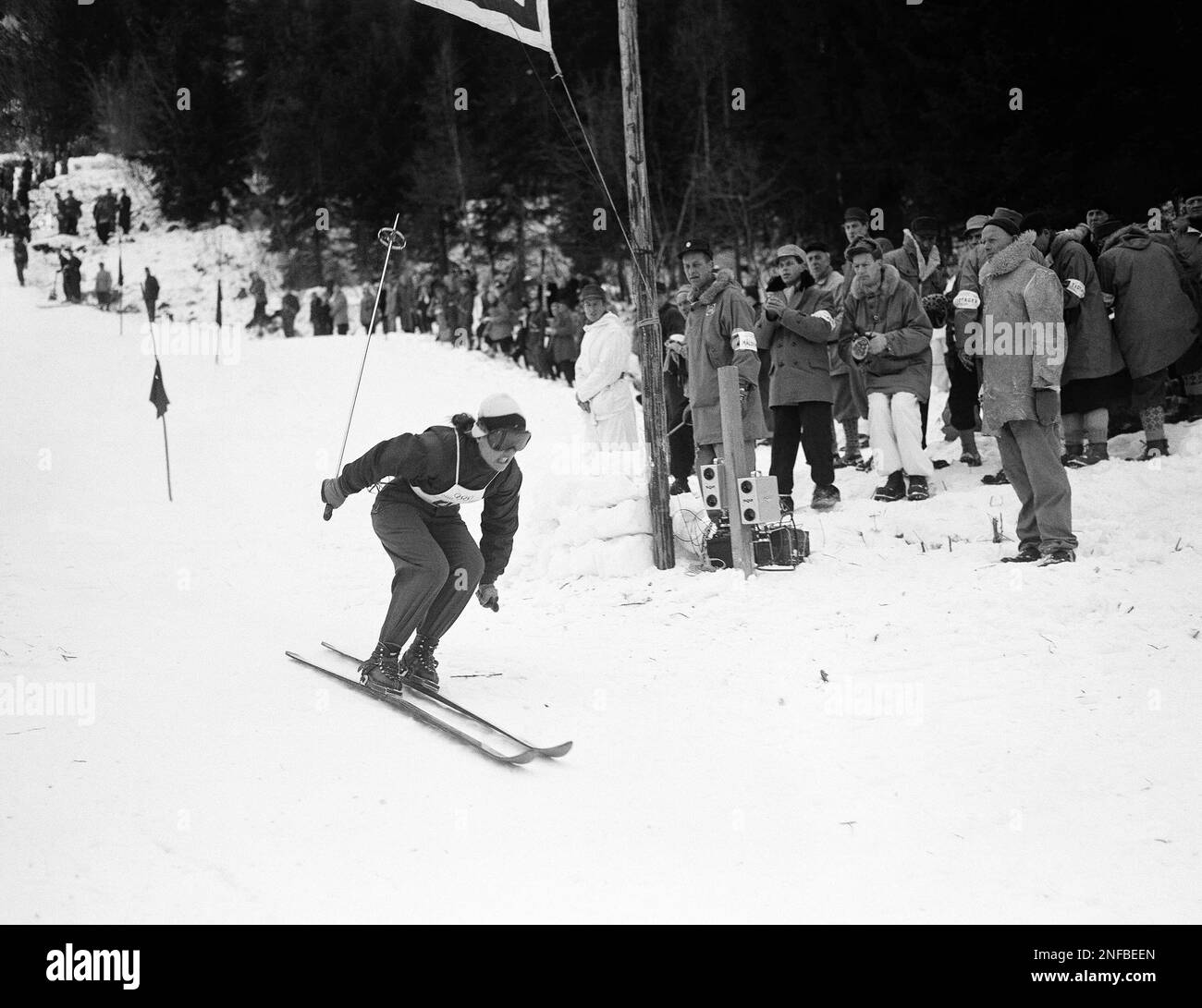 Andrea Mead Lawrence, of Rutland, Vt., flashes across finish line to ...