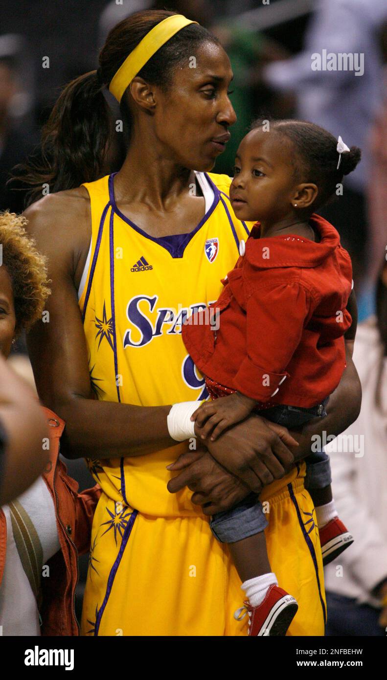 Los Angeles Sparks Lisa Leslie holds her daughter Lauren Jolie Lockwood after the Atlanta Dream defeated the Los Angeles Sparks 83 72 in a WNBA basketball game at the Staples Center on Thursday