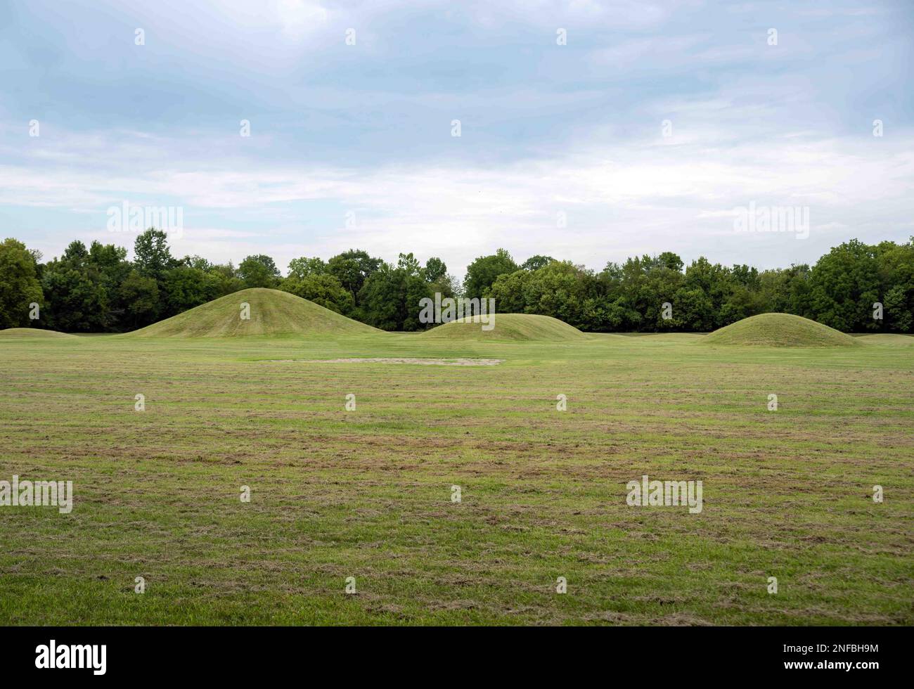 Native American Hopewell Culture prehistoric Earthworks burial mounds in Mound City Park Ohio. Ancient circular mounds and long mounds in a row. Stock Photo