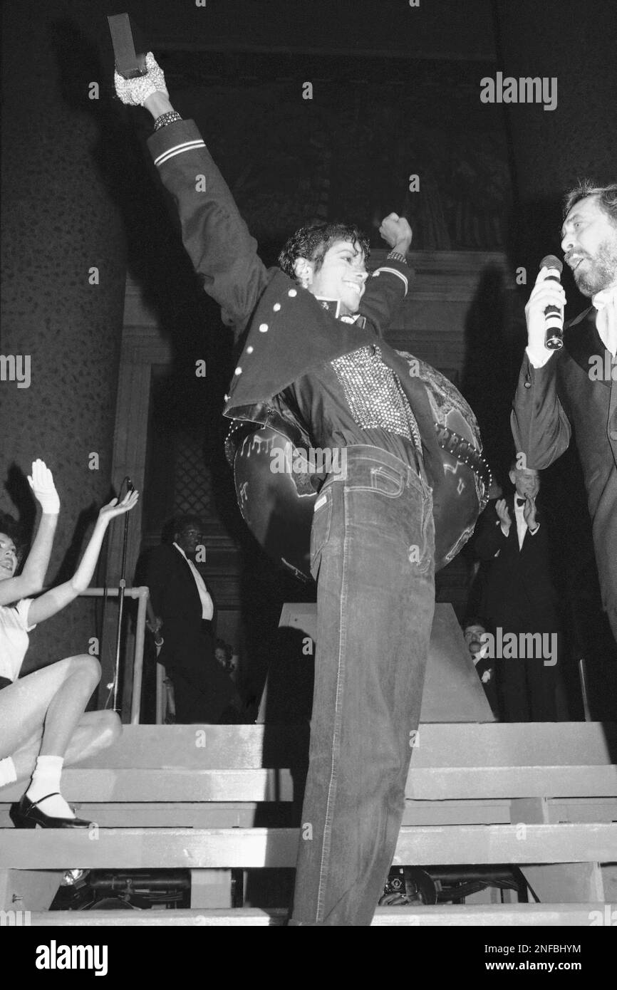 Singer Michael Jackson, center, is honored for record sales during a