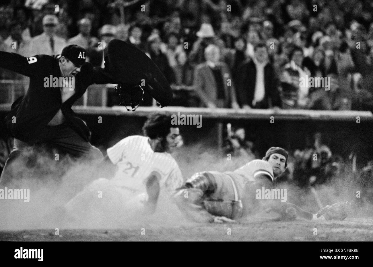Philadelphia Phillies runner Bake McBride (21) tumbles through a cloud