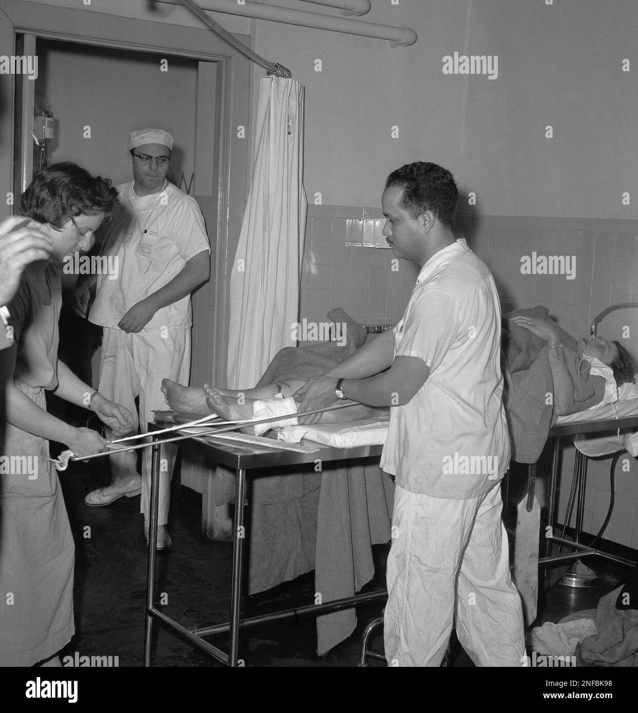 Lorraine Sullivan of Hempstead, N.Y., lies on a gurney in the emergency room of Flushing